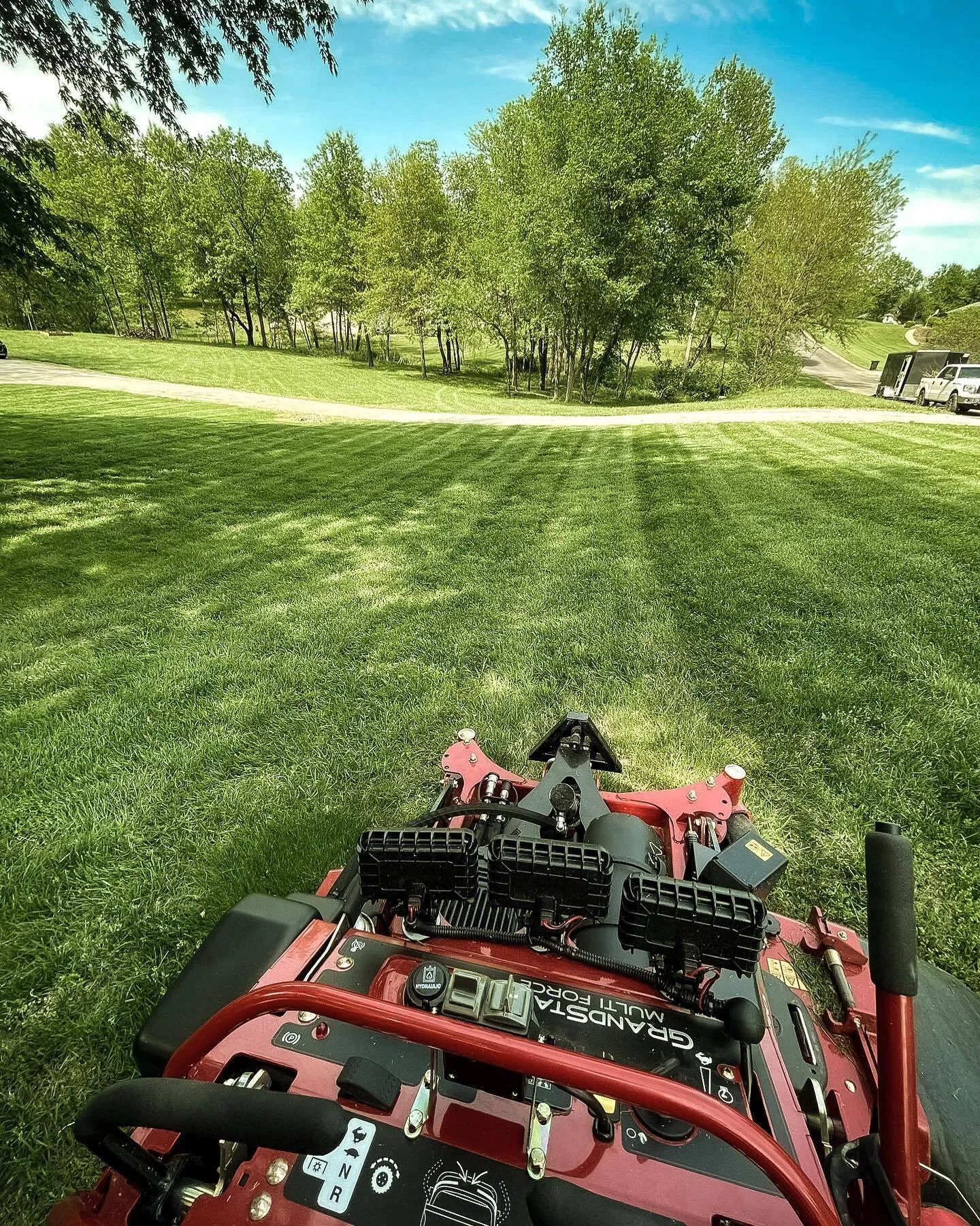 Urban Diamond commercial stand-on mower striping a lawn