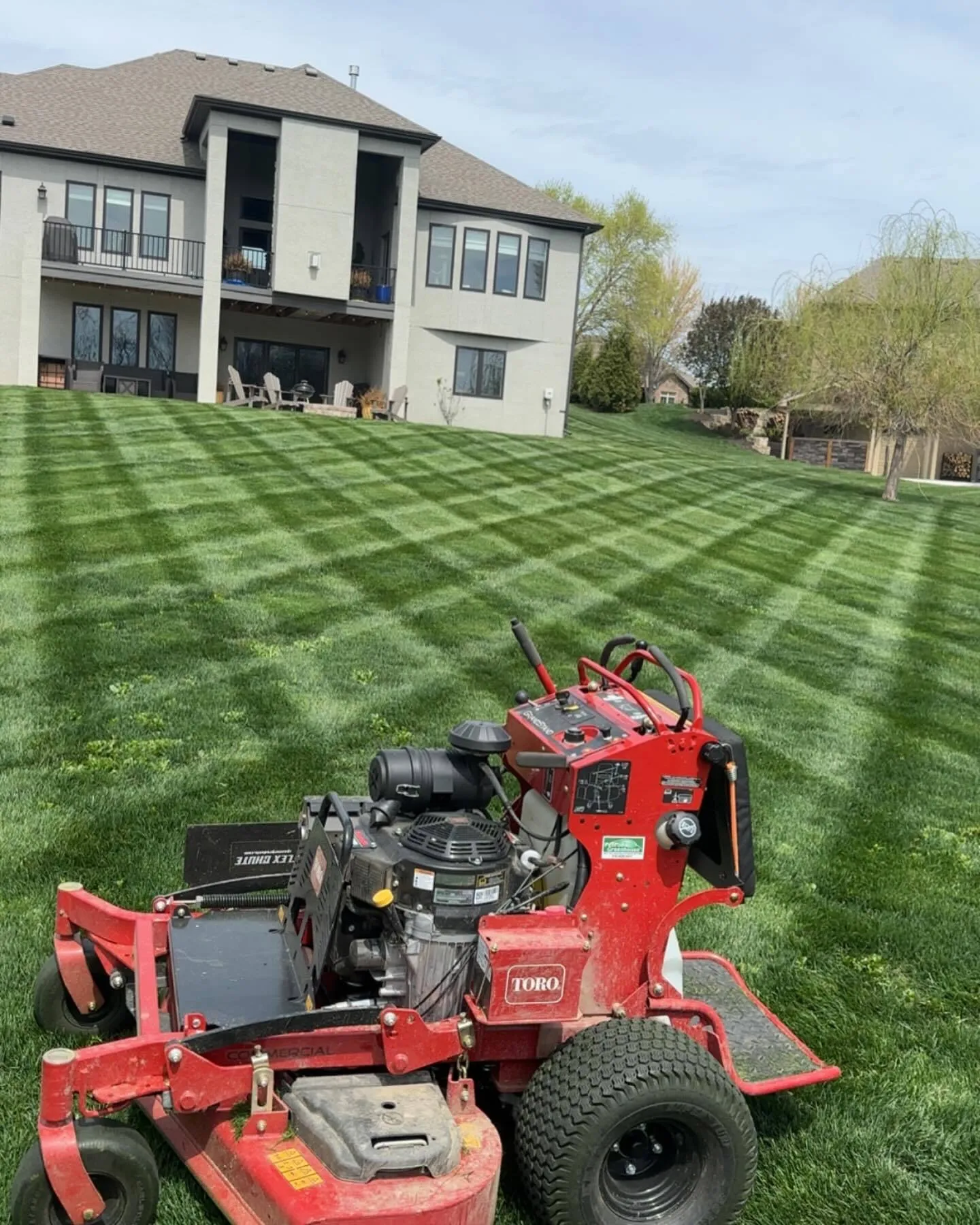 Professional crosshatch striping on green residential lawn