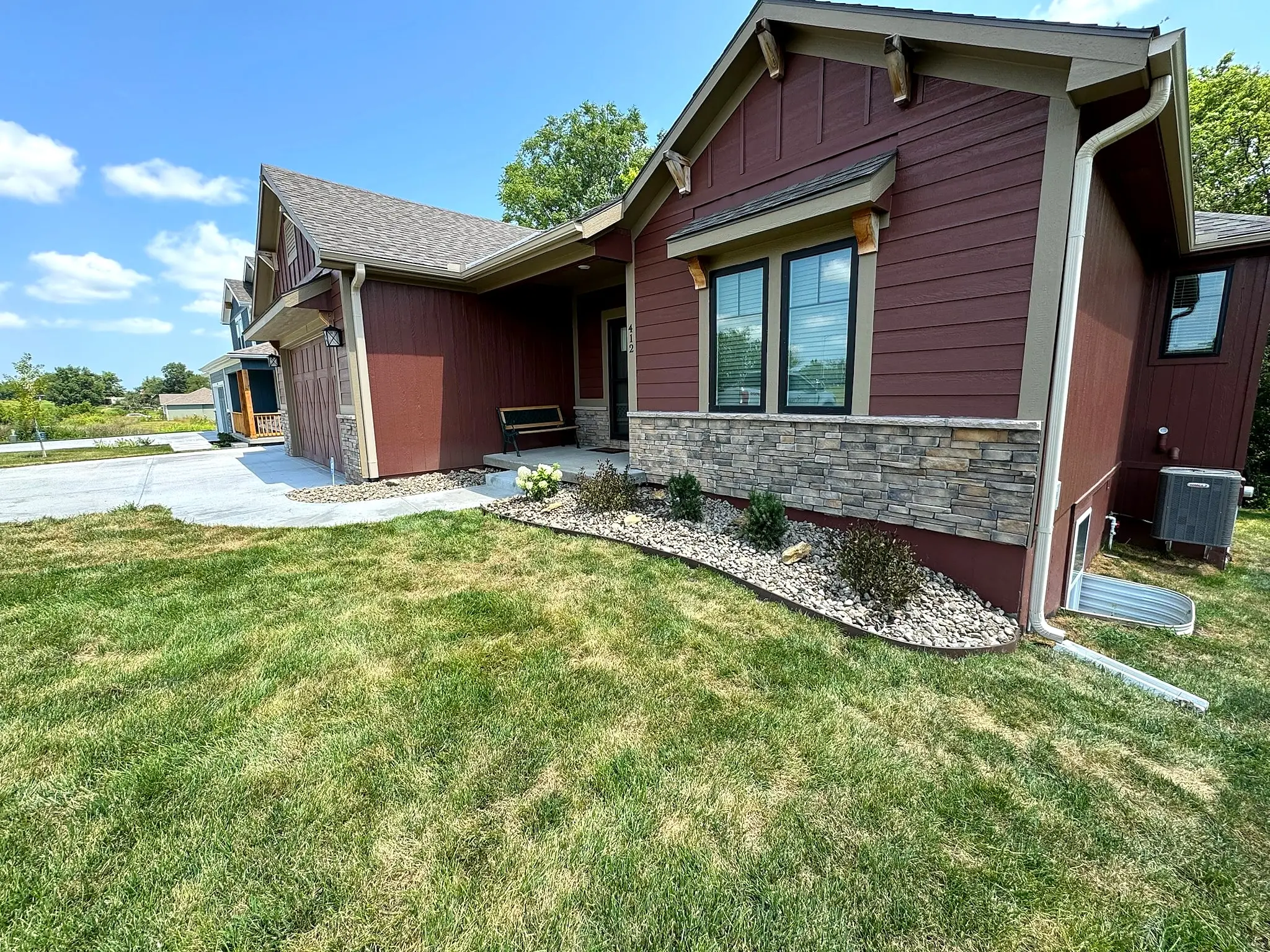 Finished landscape bed and new lawn at a Kansas City Northland home