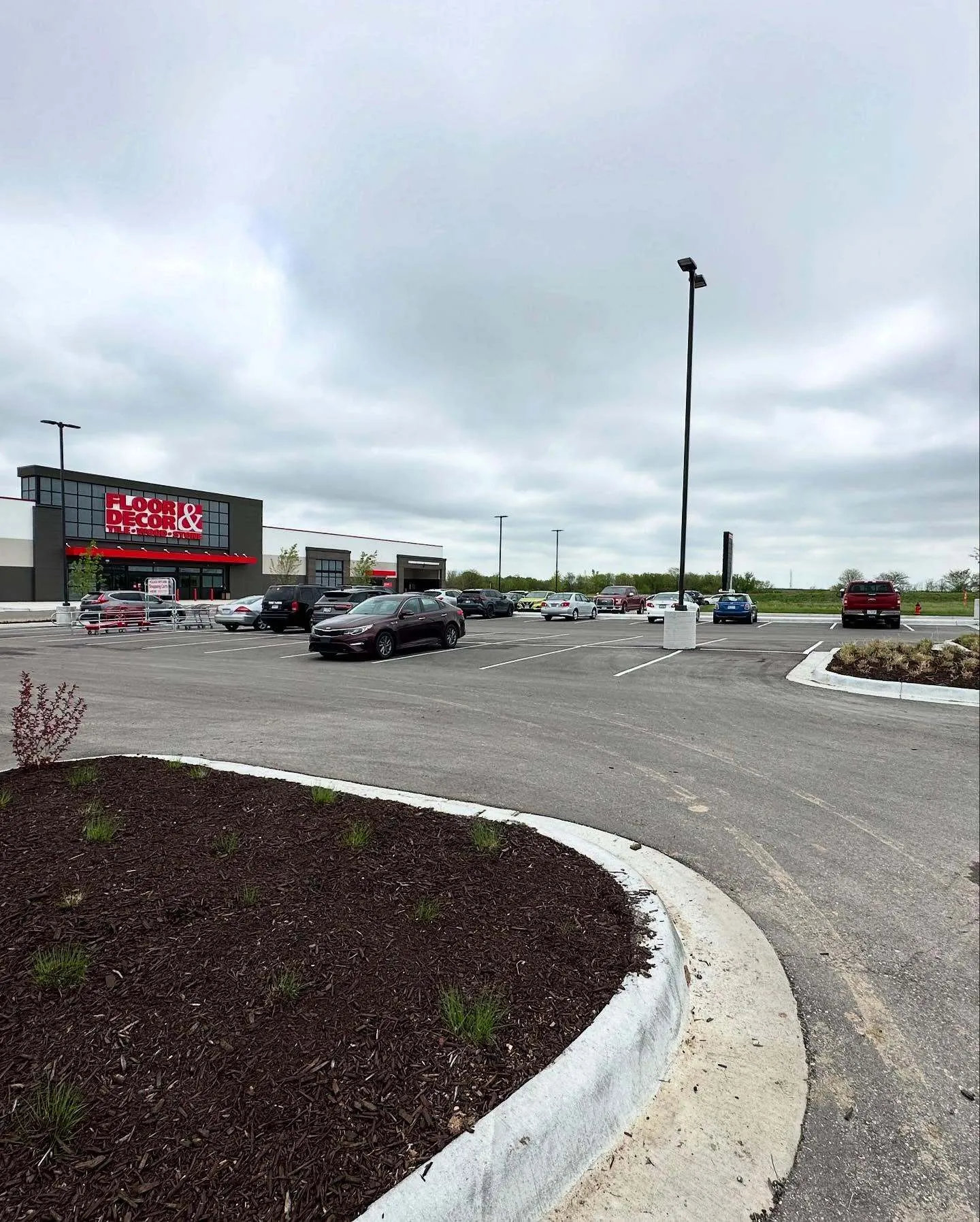 Fresh mulch bed and landscaping by Urban Diamond