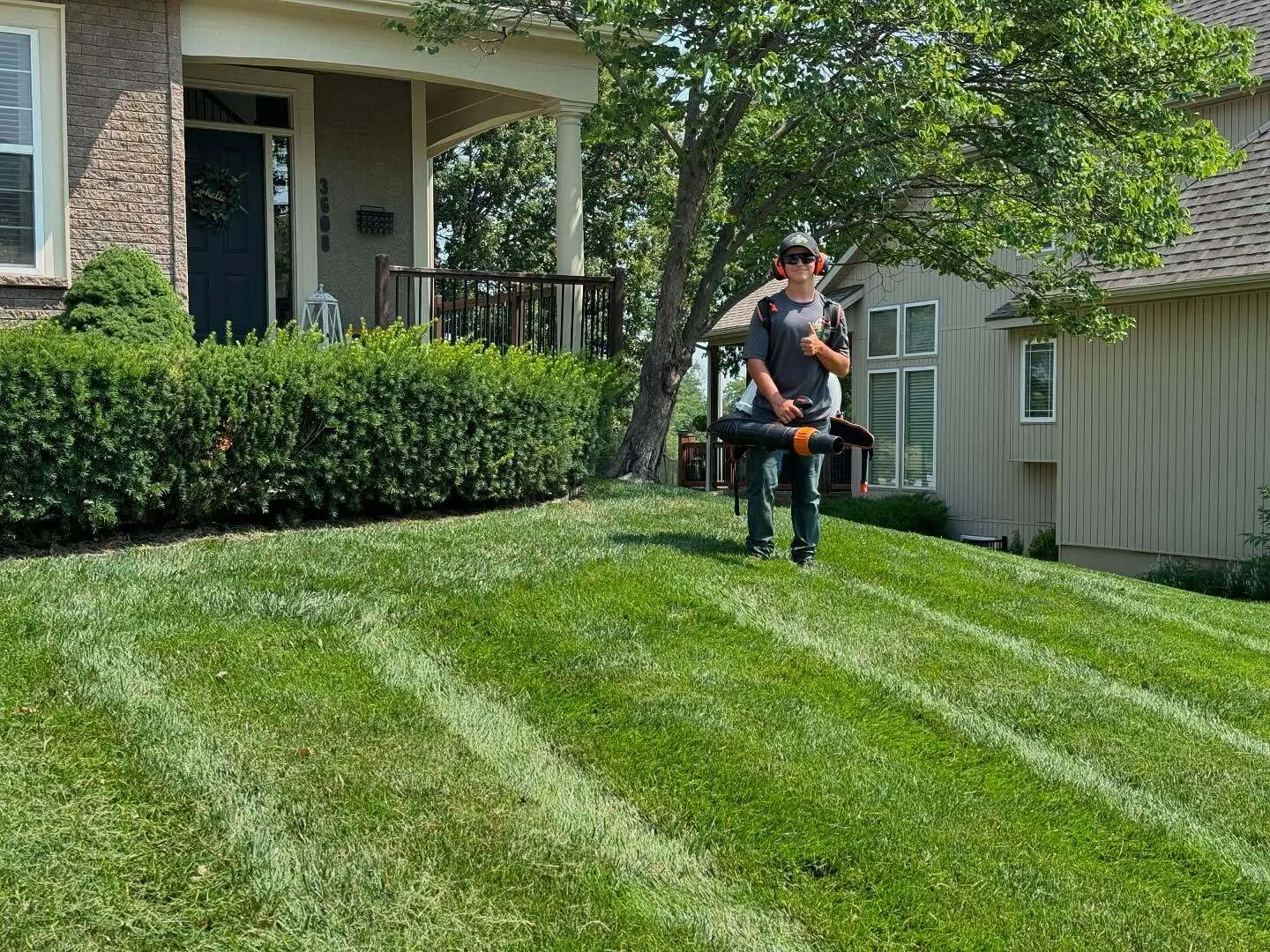 Weekly lawn mowing service with striped finish