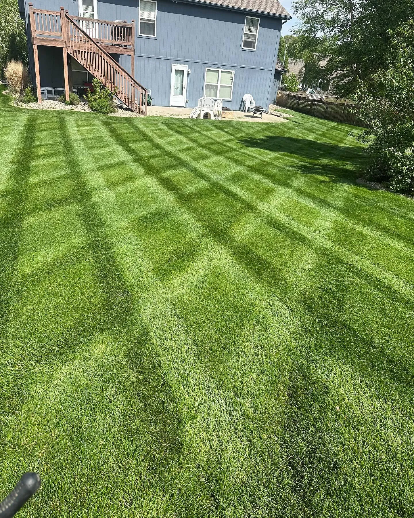 Professional crosshatch lawn striping pattern on Kansas City residential property