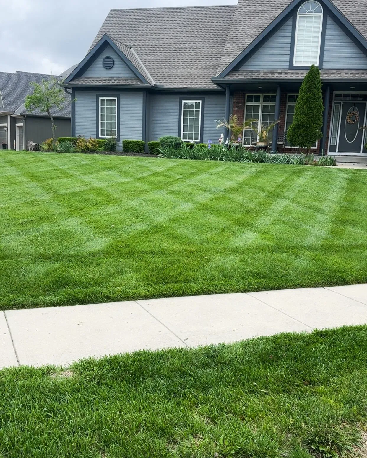 Lush green lawn with professional striping